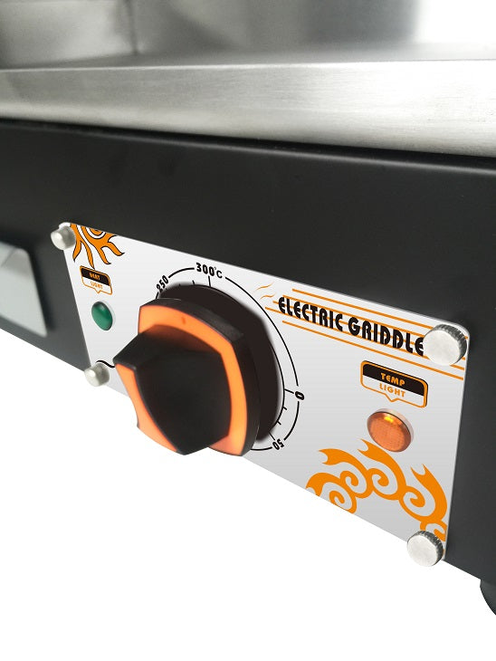Control panel of an electric griddle with temperature knobs and branding.