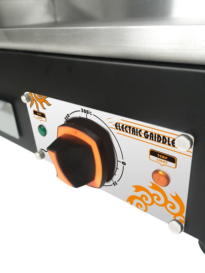 Control panel of an electric griddle with temperature knobs and branding.